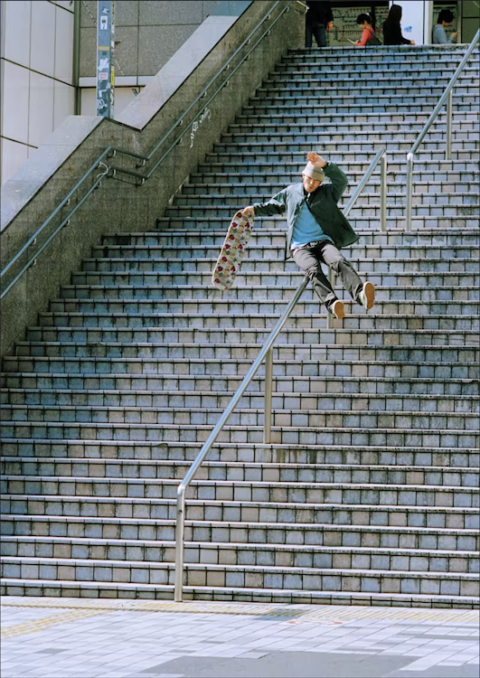 Gou Miyagi sliding down a handrail